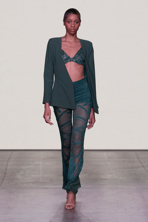 LACE BODYSUIT AND JACKET OVER TROUSERS