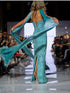Embellished Turquoise Gown with Flowing Cape