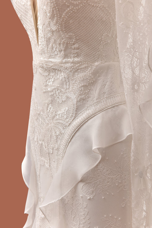 INLAID, FRENCH LACE WEDDING DRESS WITH FLOUNCE SLEEVE AND HIP DETAIL - Barrus London
